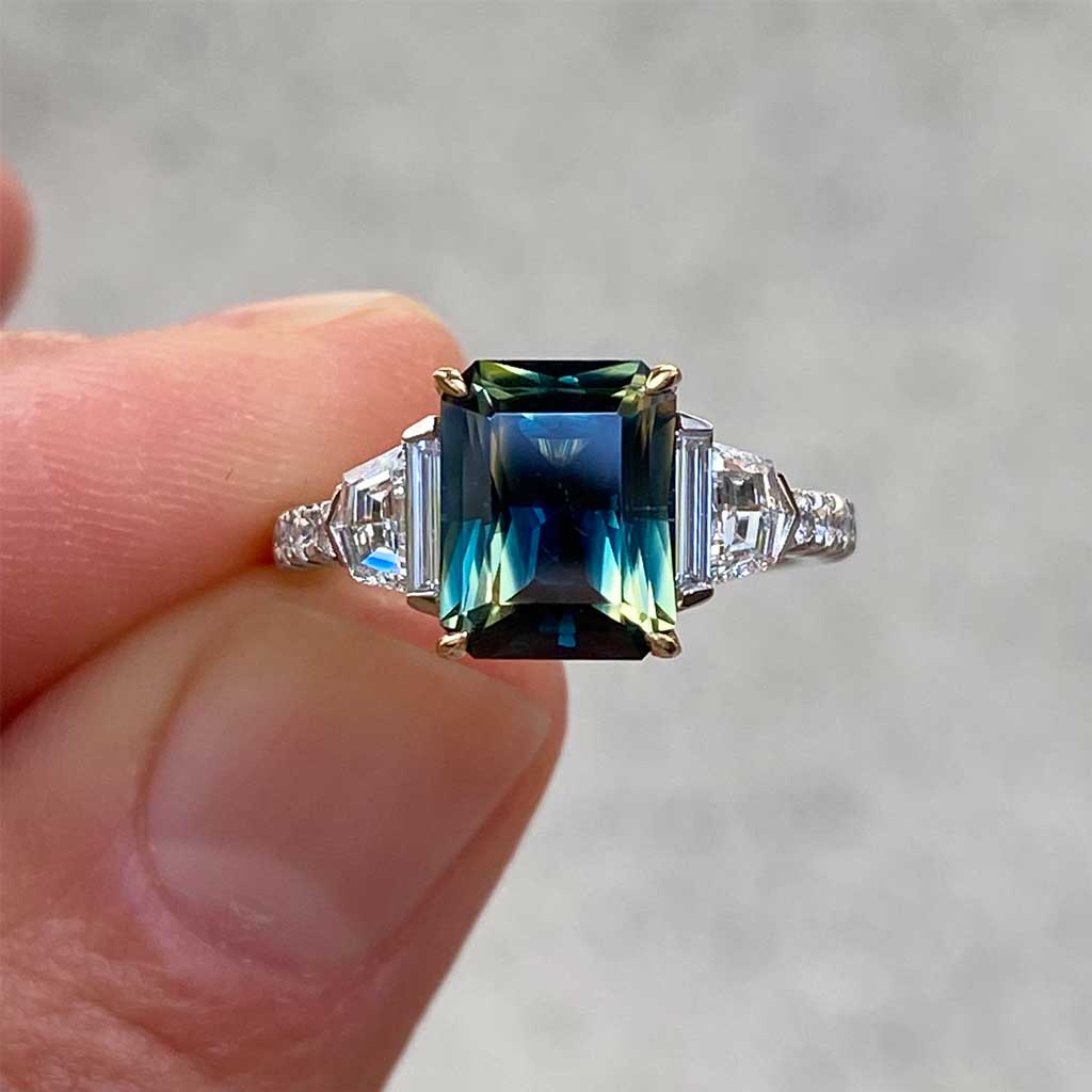 Australian parti teal emerald cut sapphire bespoke engagement ring Sydney jeweller Lizunova Fine Jewels Sydney Australia