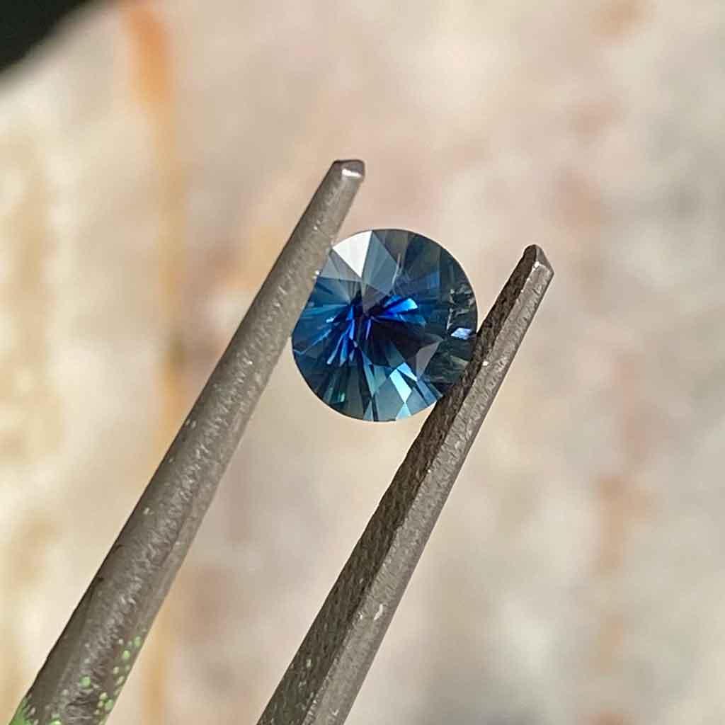 0.65ct round Madagascan teal sapphire - Lizunova Fine Jewels