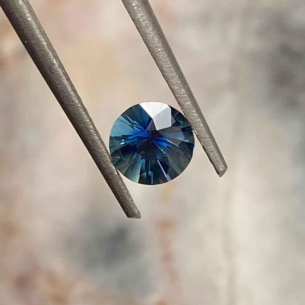 0.65ct round Madagascan teal sapphire - Lizunova Fine Jewels