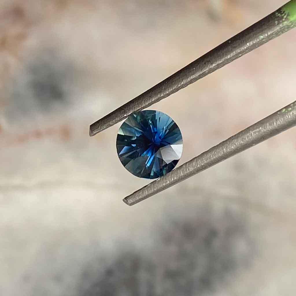 0.65ct round Madagascan teal sapphire - Lizunova Fine Jewels
