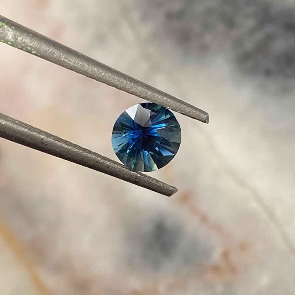 0.65ct round Madagascan teal sapphire - Lizunova Fine Jewels