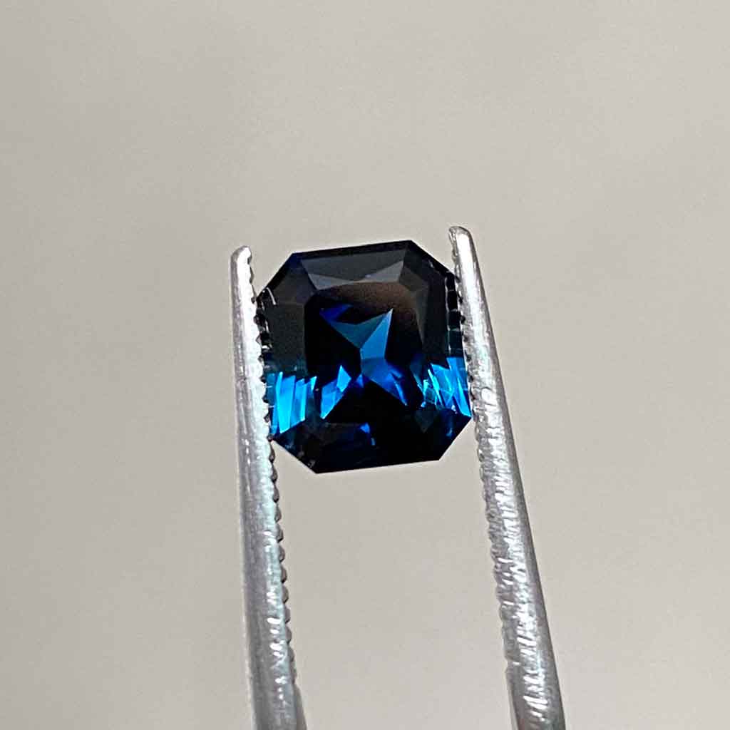 Emerald radiant cut Australian teal sapphire bespoke engagement ring Sydney jeweller Lizunova Fine Jewels Australia