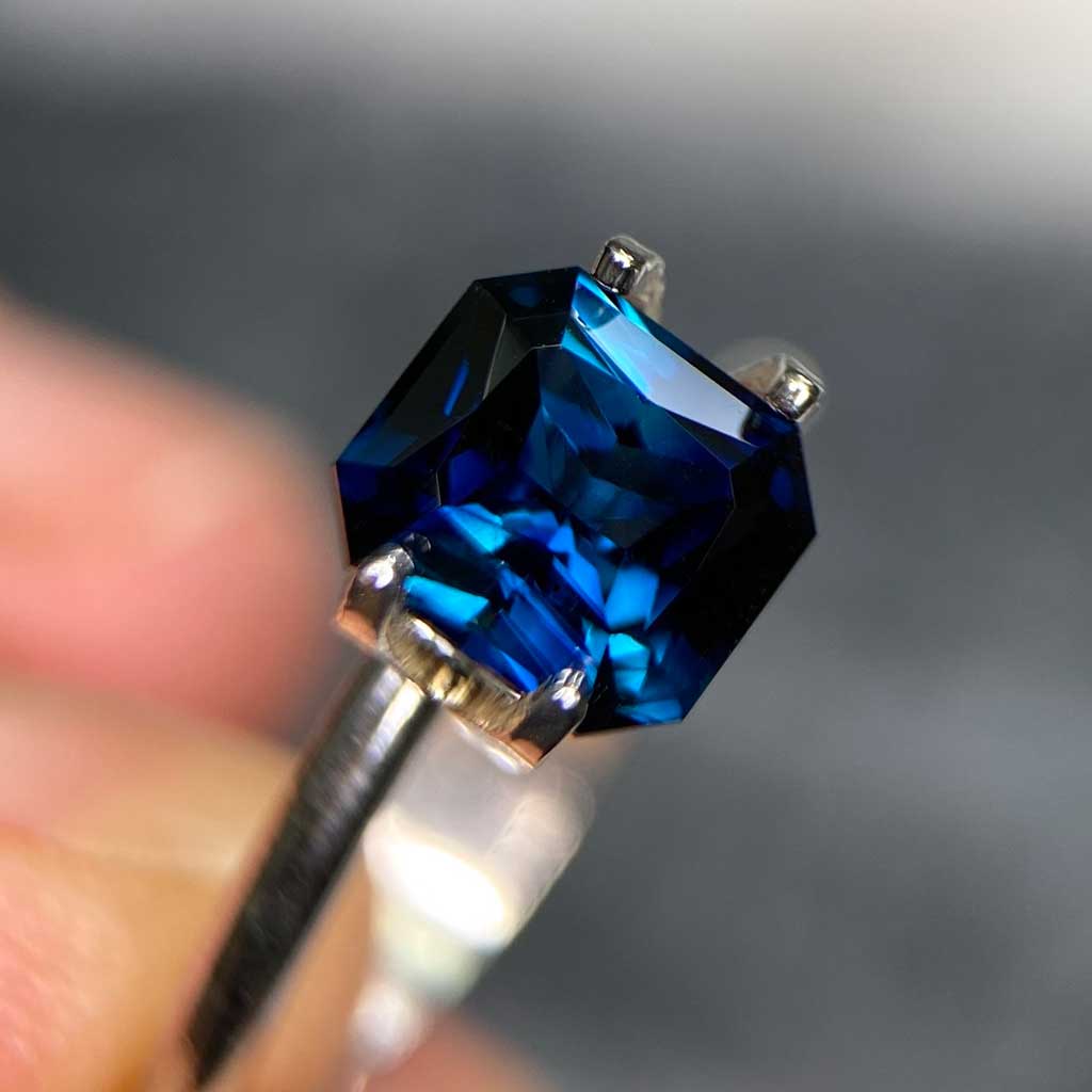 Emerald radiant cut Australian teal sapphire bespoke engagement ring Sydney jeweller Lizunova Fine Jewels Australia