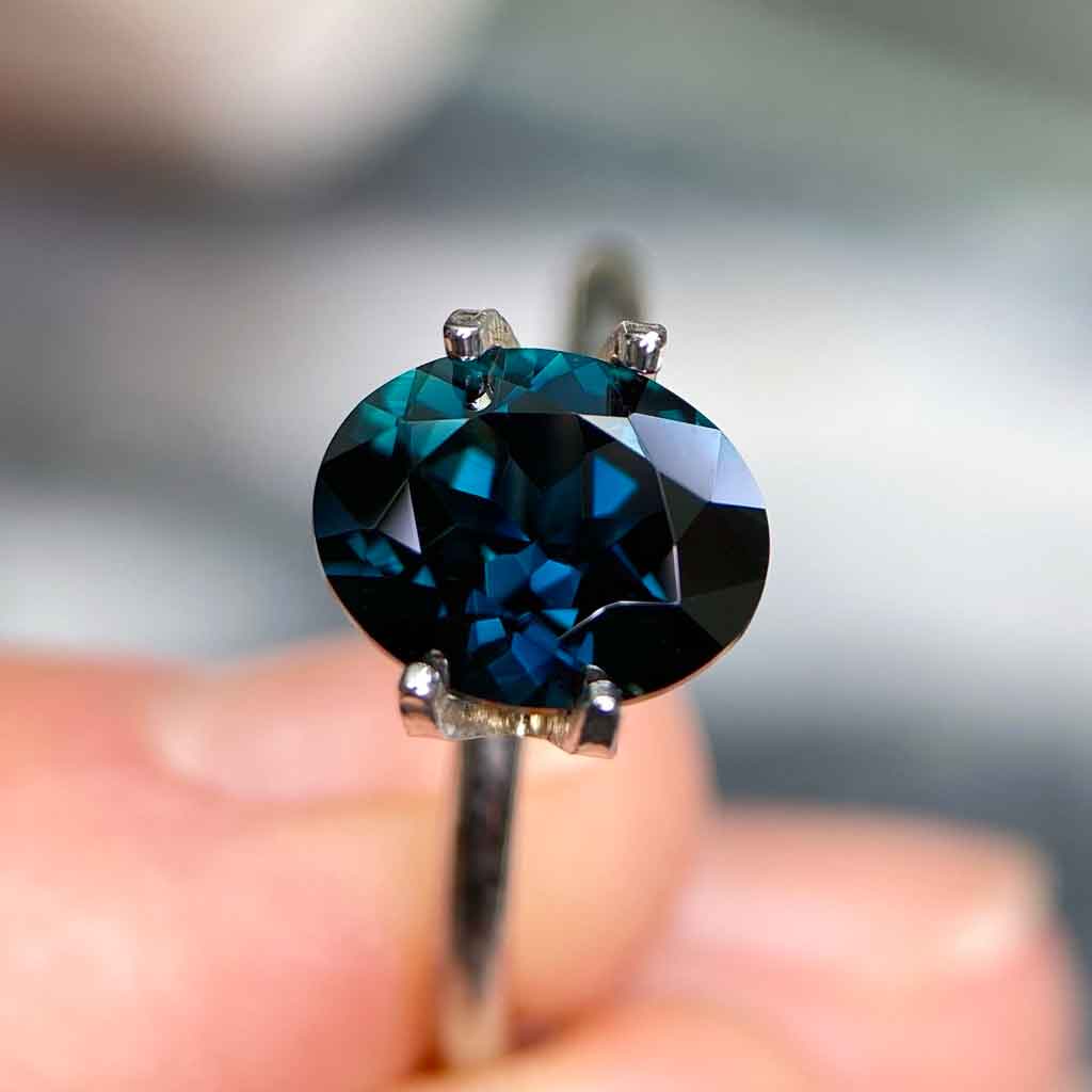 Oval Australian teal sapphire available to set in a bespoke engagement ring by Sydney jeweller Lizunova, Australia