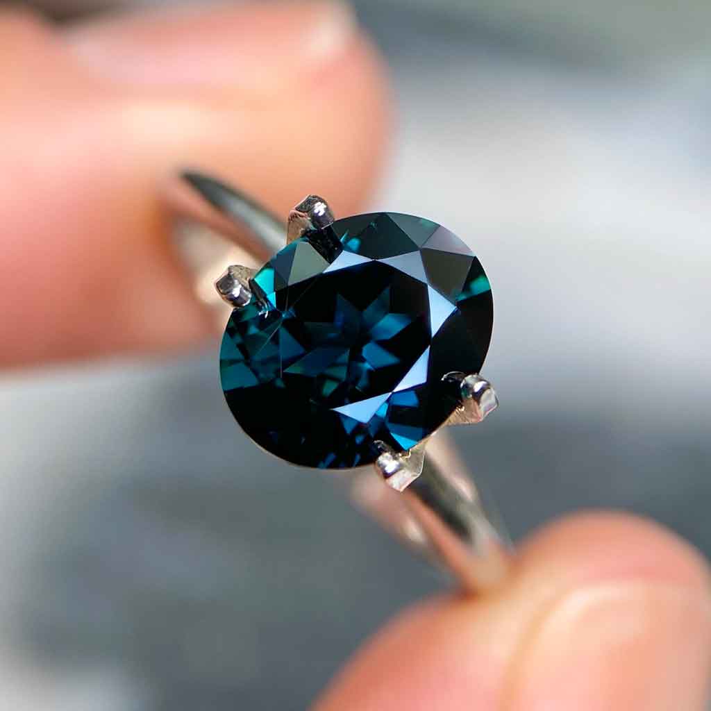 Oval Australian teal sapphire available to set in a bespoke engagement ring by Sydney jeweller Lizunova, Australia