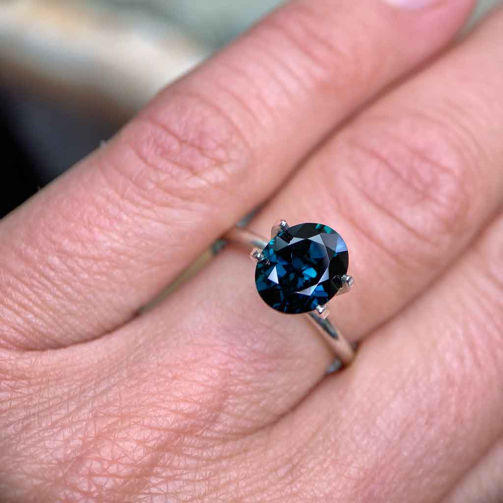 Oval Australian teal sapphire available to set in a bespoke engagement ring by Sydney jeweller Lizunova, Australia