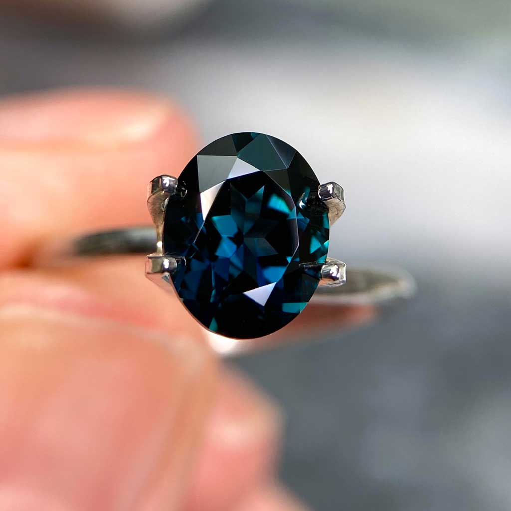 Oval Australian teal sapphire available to set in a bespoke engagement ring by Sydney jeweller Lizunova, Australia