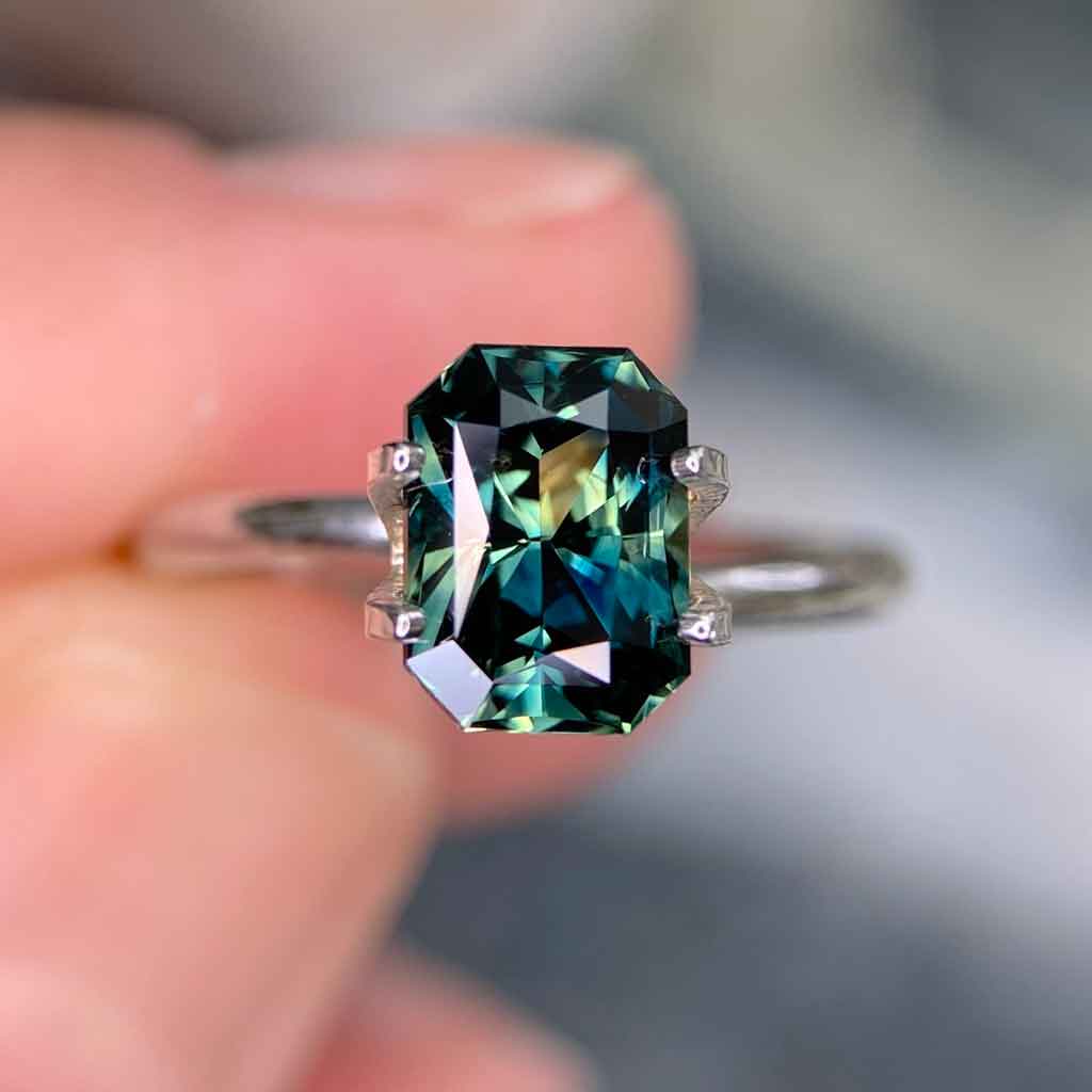 2.51ct emerald radiant cut Australian teal parti sapphire available to set in a bespoke sapphire engagement ring by Sydney jeweller Lizunova NSW Australia