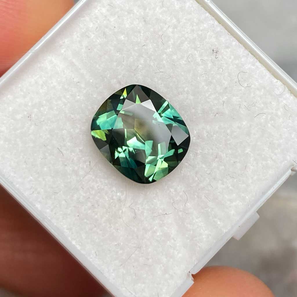 2.71ct cushion cut Australian parti sapphire available for a bespoke engagement ring by Lizunova Fine Jewels
