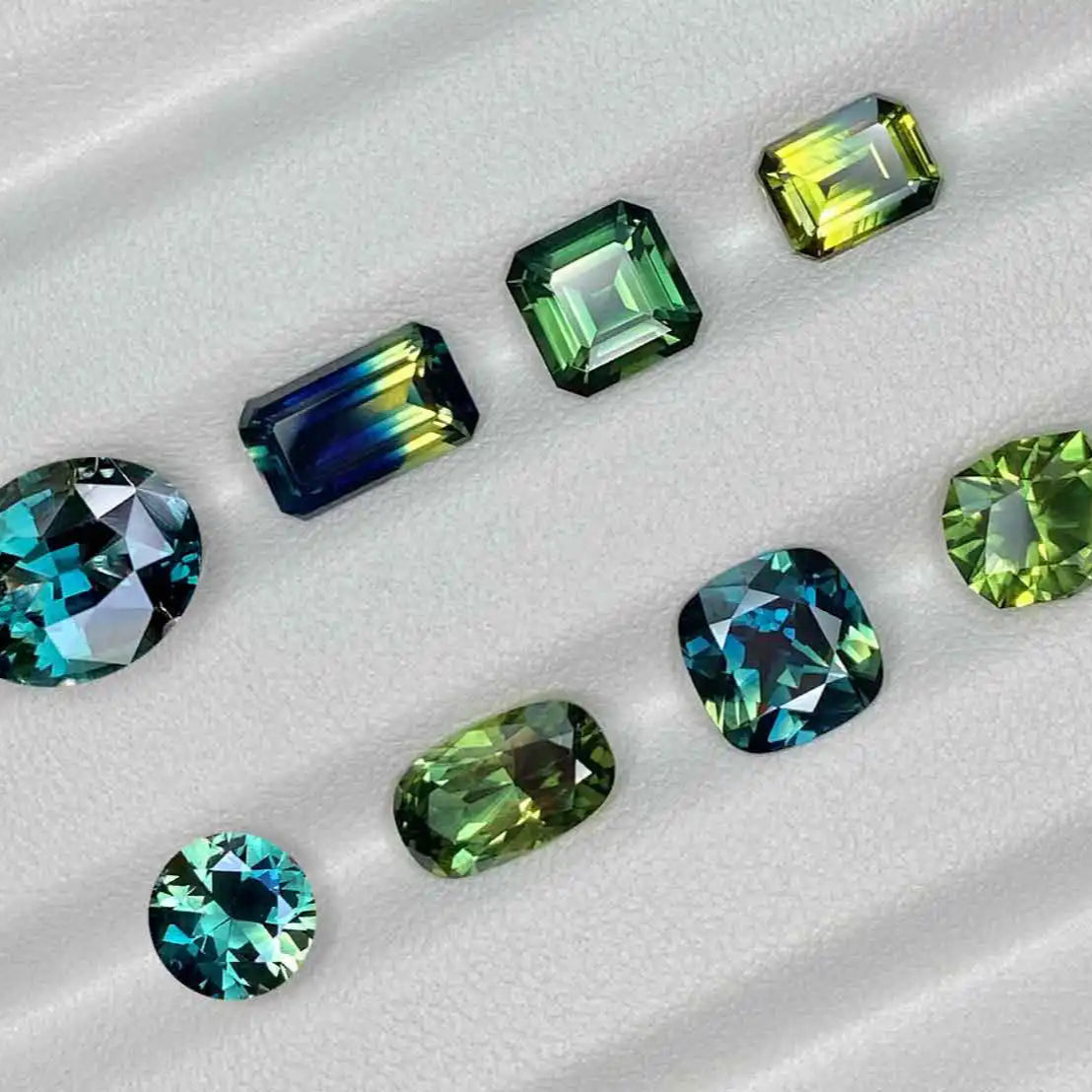 Teal, parti and green Australian sapphires in oval, emerald cut, asscher cut, round, barion and cushion shapes, by bespoke Australian jeweller Lizunova Fine Jewels, Sydney