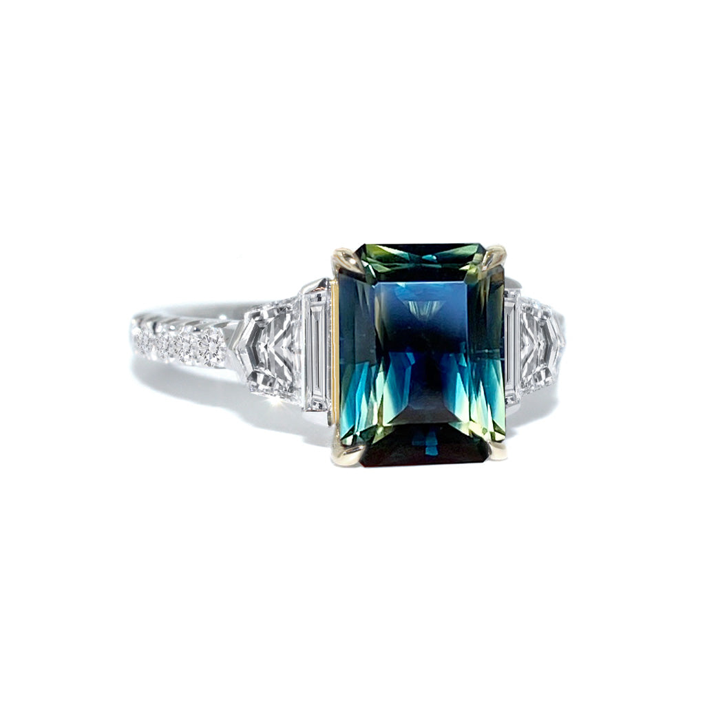 Australian parti teal emerald cut sapphire bespoke engagement ring Sydney jeweller Lizunova Fine Jewels Sydney Australia