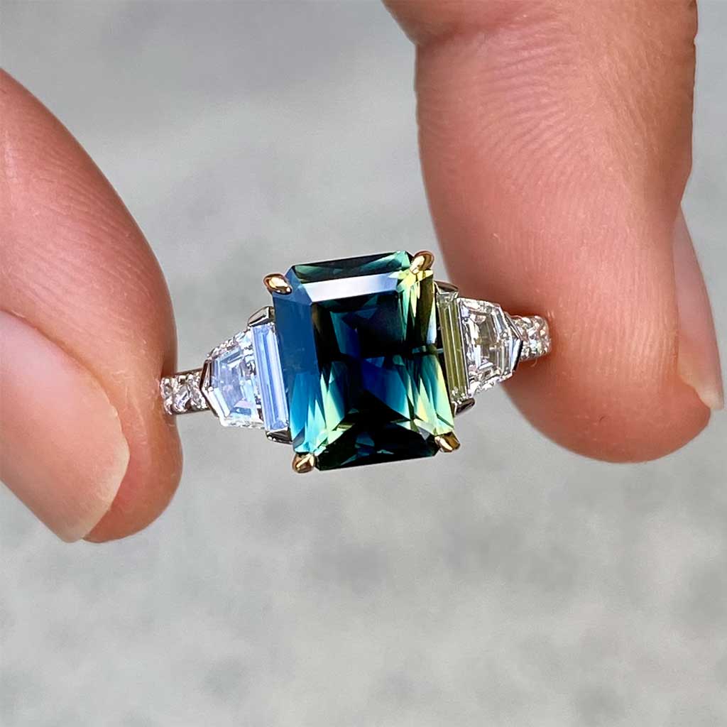 Australian parti teal emerald cut sapphire bespoke engagement ring Sydney jeweller Lizunova Fine Jewels Sydney Australia