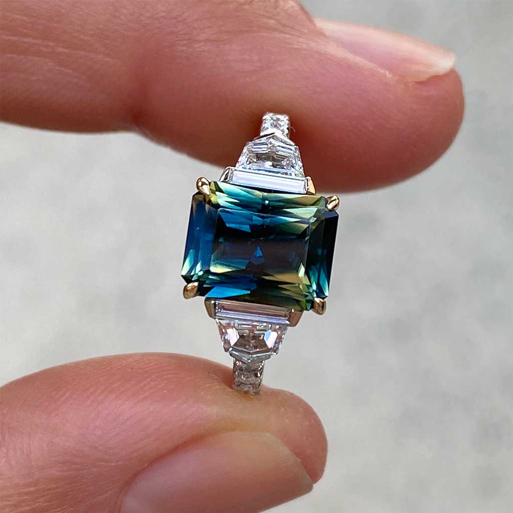 Australian parti teal emerald cut sapphire bespoke engagement ring Sydney jeweller Lizunova Fine Jewels Sydney Australia