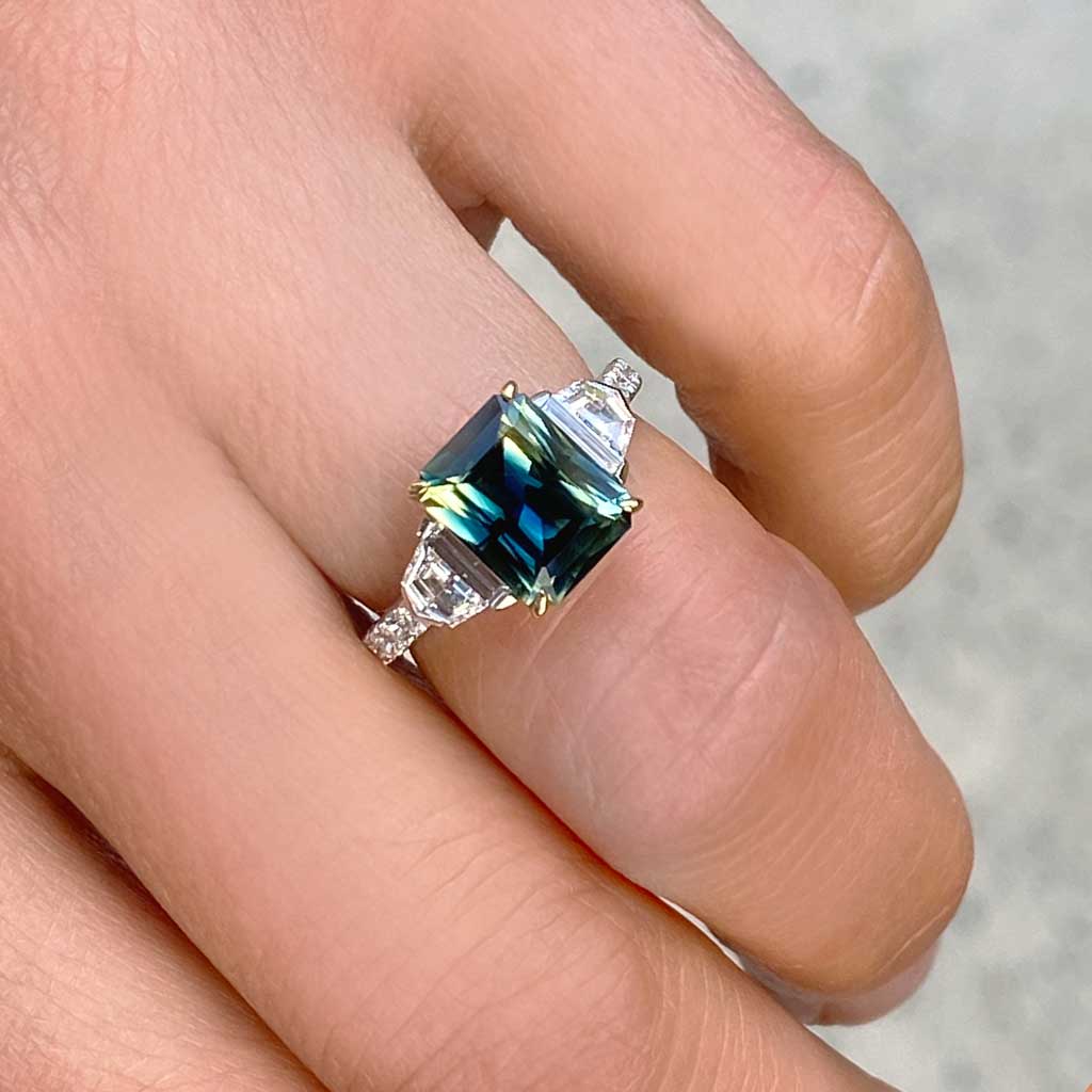 Australian parti teal emerald cut sapphire bespoke engagement ring Sydney jeweller Lizunova Fine Jewels Sydney Australia
