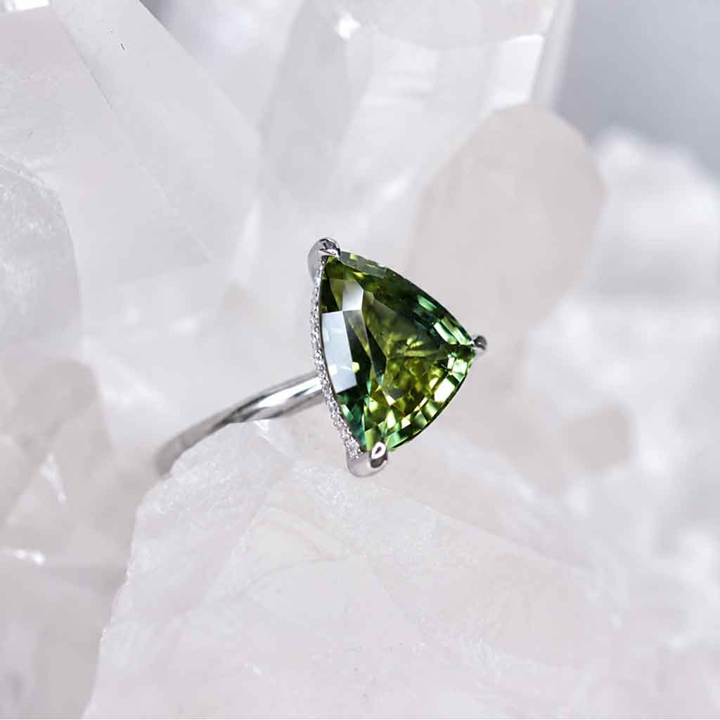 Freeform asymmetric Australian parti sapphire engagement ring with a hidden diamond halo by Lizunova Fine Jewels