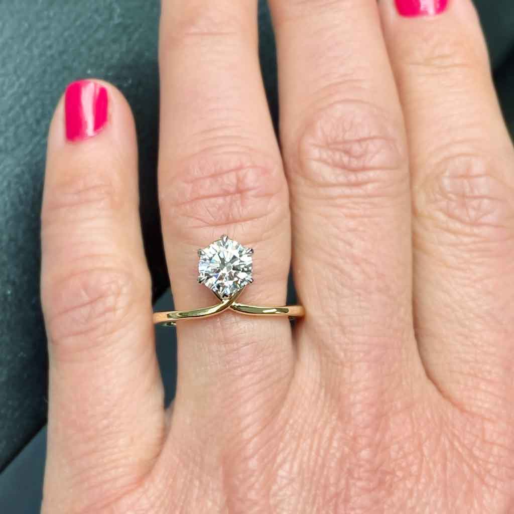 Infinity-lab-diamond-gold-engagement-ring-on-wedding-womans-finger