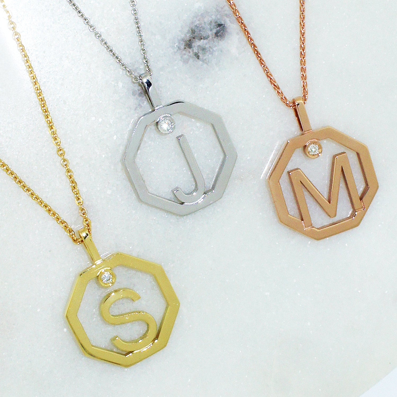 Initial-pendants-flat-lay-Lizunova-Fine-Jewels-Sydney-NSW-Australia
