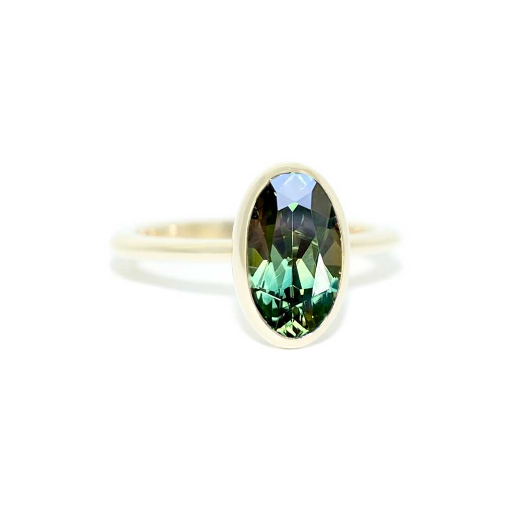 Bezel set oval Australian green teal sapphire engagement ring, Sydney jeweller Lizunova
