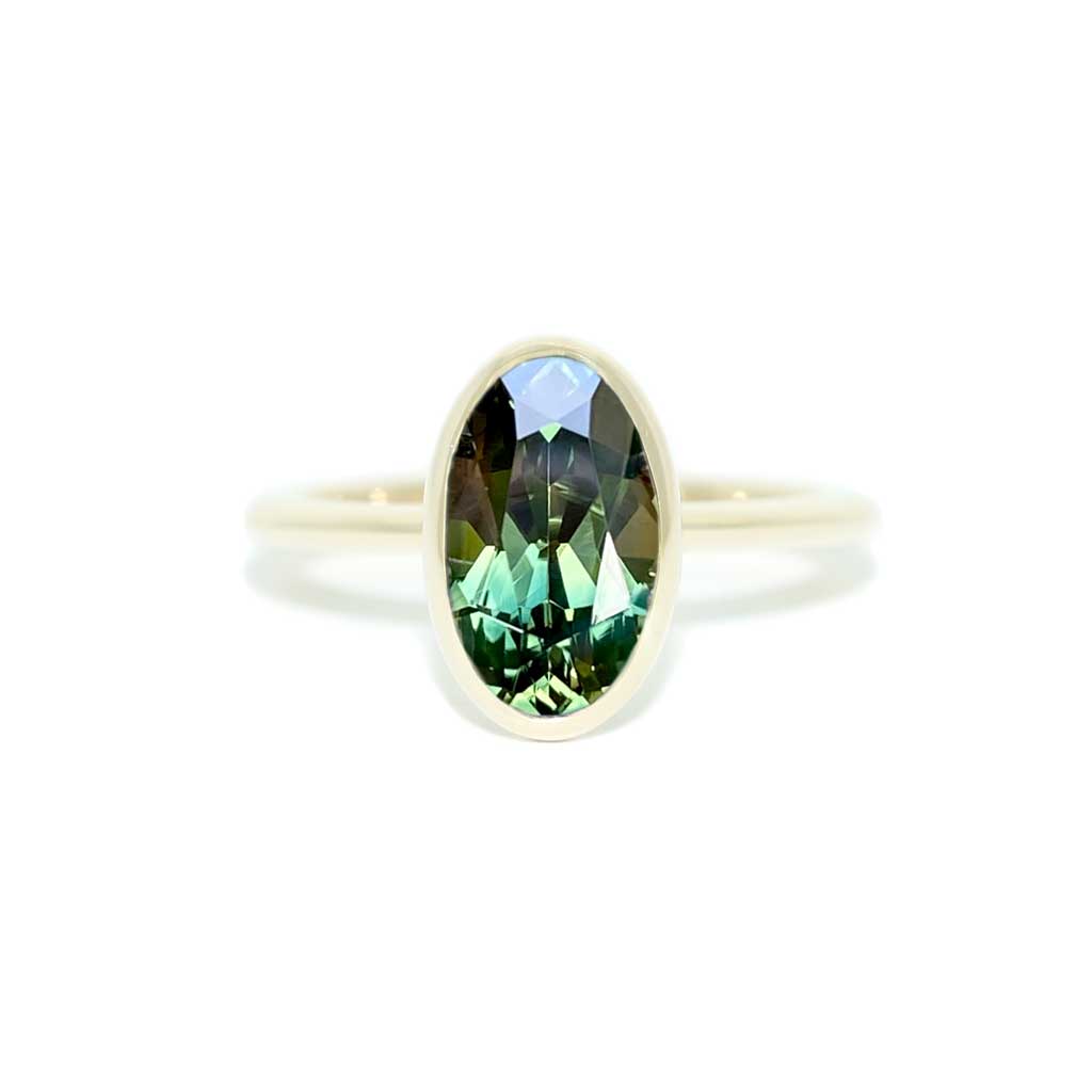 Bezel set oval Australian green teal sapphire engagement ring, Sydney jeweller Lizunova