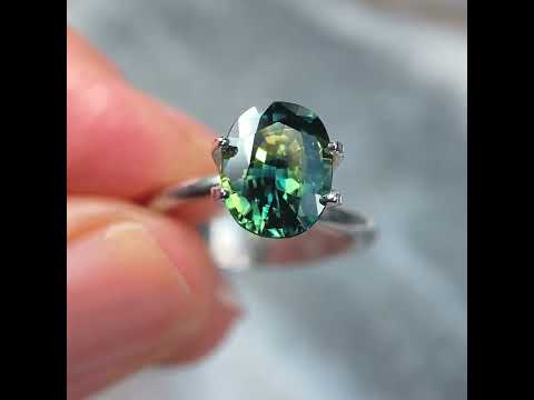 Oval Australian parti sapphire in blue, green, yellow colours, available to set in a sapphire engagement ring by Sydney jeweller Lizunova