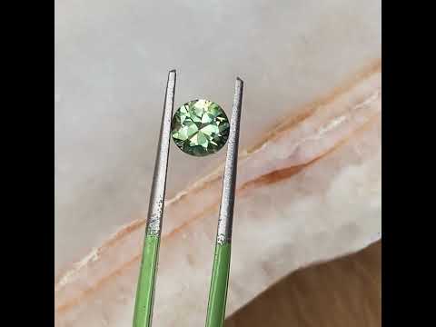 1.15ct round Australian light green parti sapphire, available for a bespoke sapphire engagement ring, by Sydney jeweller Lizunova Fine Jewels, Australia