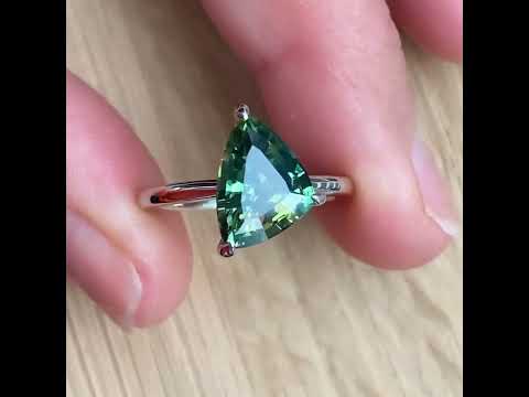 Freeform asymmetric Australian parti sapphire engagement ring with a hidden diamond halo by Lizunova Fine Jewels