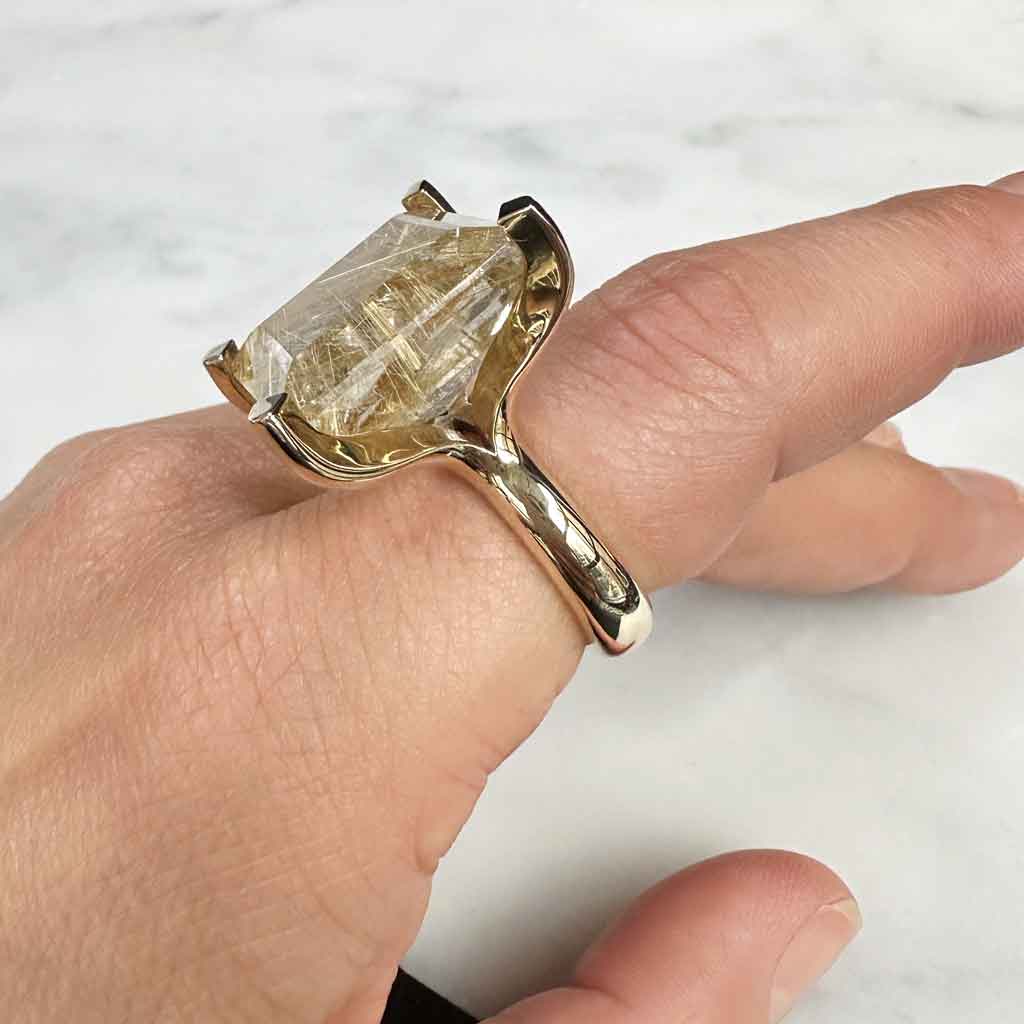 Sculptural cocktail ring in solid gold with a rutilated quartz, by Sydney jeweller Lizunova