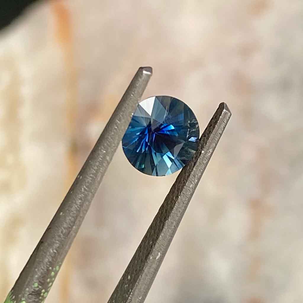 round-teal-Madagascan-sapphire-custom-engagement-ring-Sydney-jeweller-Lizunova-Fine-Jewels