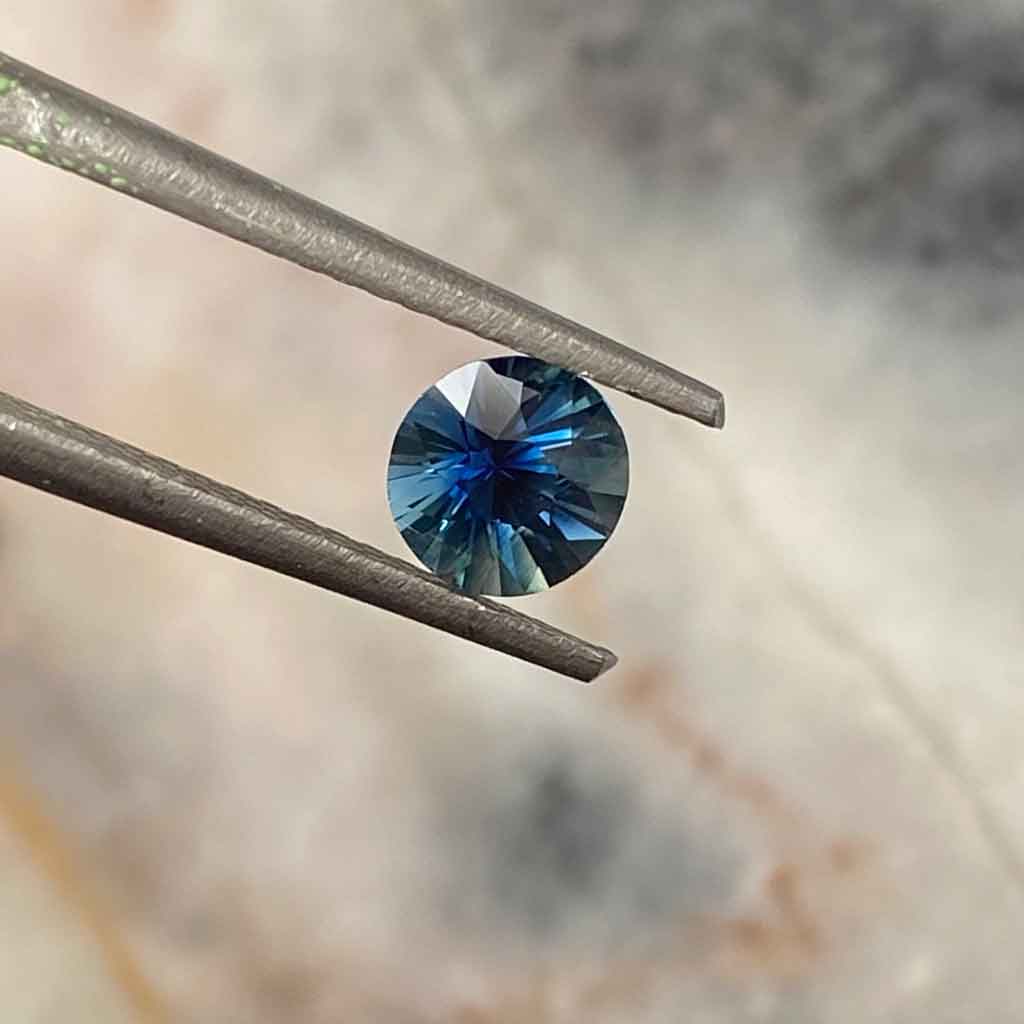 round-teal-Madagascan-sapphire-custom-engagement-ring-Sydney-jeweller-Lizunova-Fine-Jewels