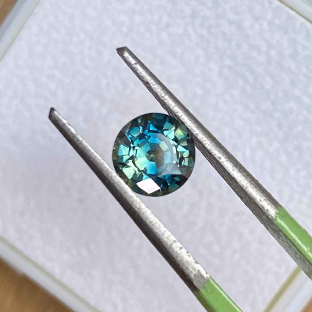 round-Australian-parti-teal-sapphire-custom-engagement-ring-Sydney-jeweller-Lizunova-Fine-Jewels