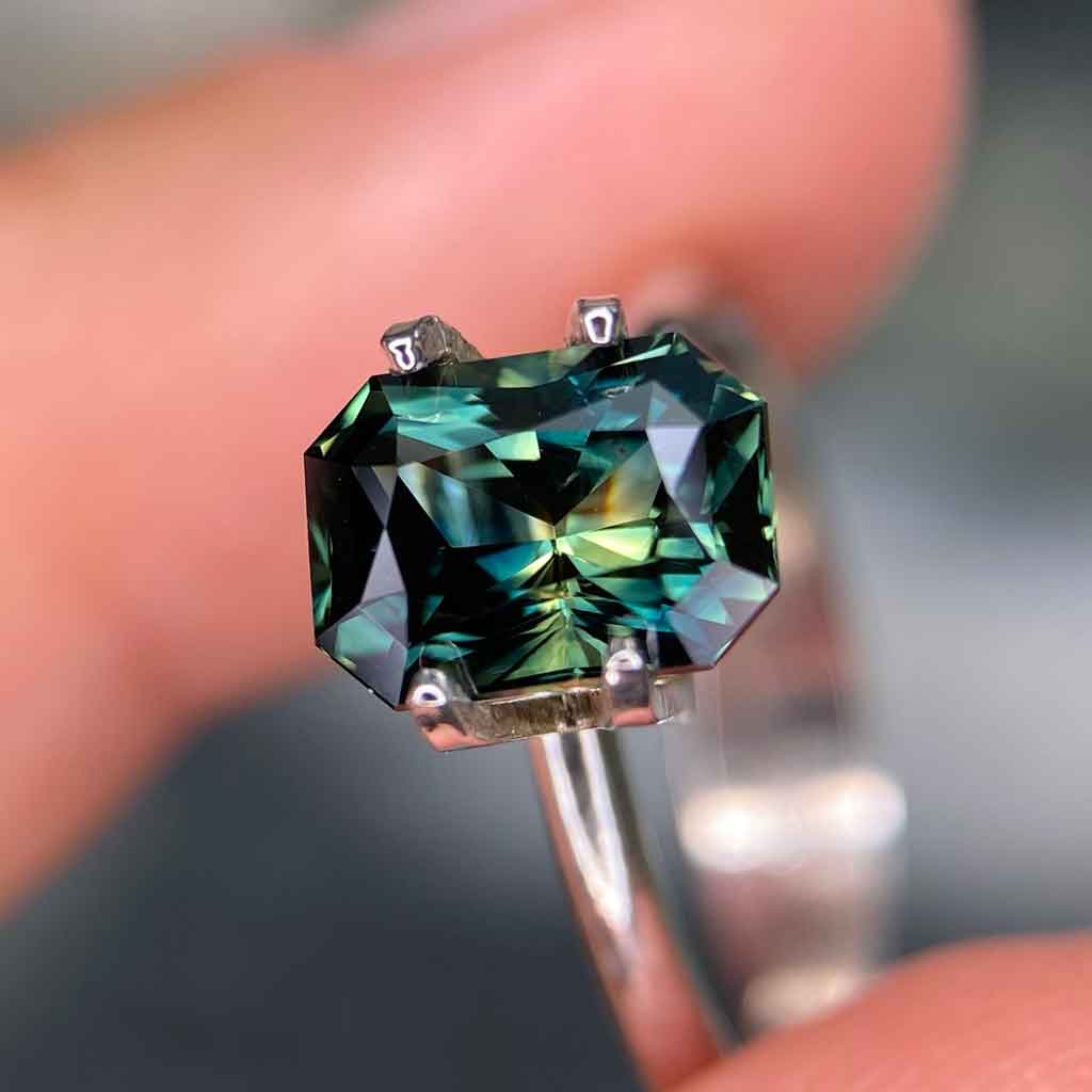 2.51ct emerald radiant cut Australian teal parti sapphire available to set in a bespoke sapphire engagement ring by Sydney jeweller Lizunova NSW Australia