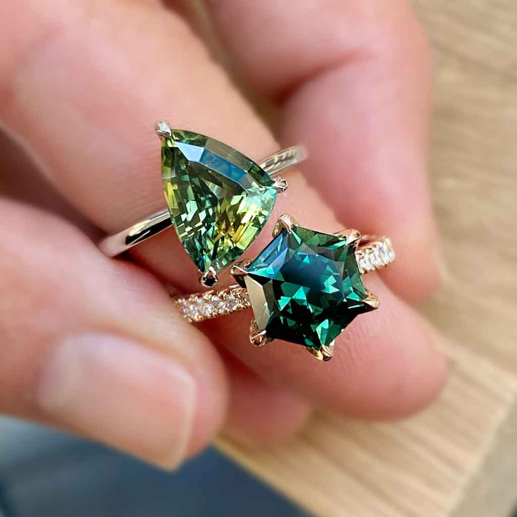Freeform asymmetric Australian parti sapphire engagement ring with a hidden diamond halo by Lizunova Fine Jewels