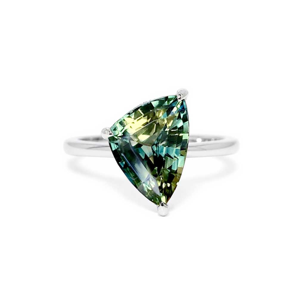 Freeform asymmetric Australian parti sapphire engagement ring with a hidden diamond halo by Lizunova Fine Jewels