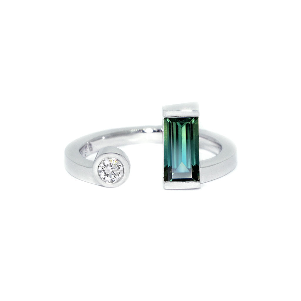 An Australian teal sapphire and diamond toi et moi ring in 18k white gold by Australian jeweller Lizunova, Sydney