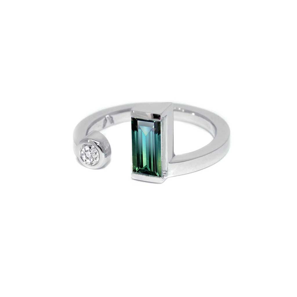 An Australian teal sapphire and diamond toi et moi ring in 18k white gold by Australian jeweller Lizunova, Sydney