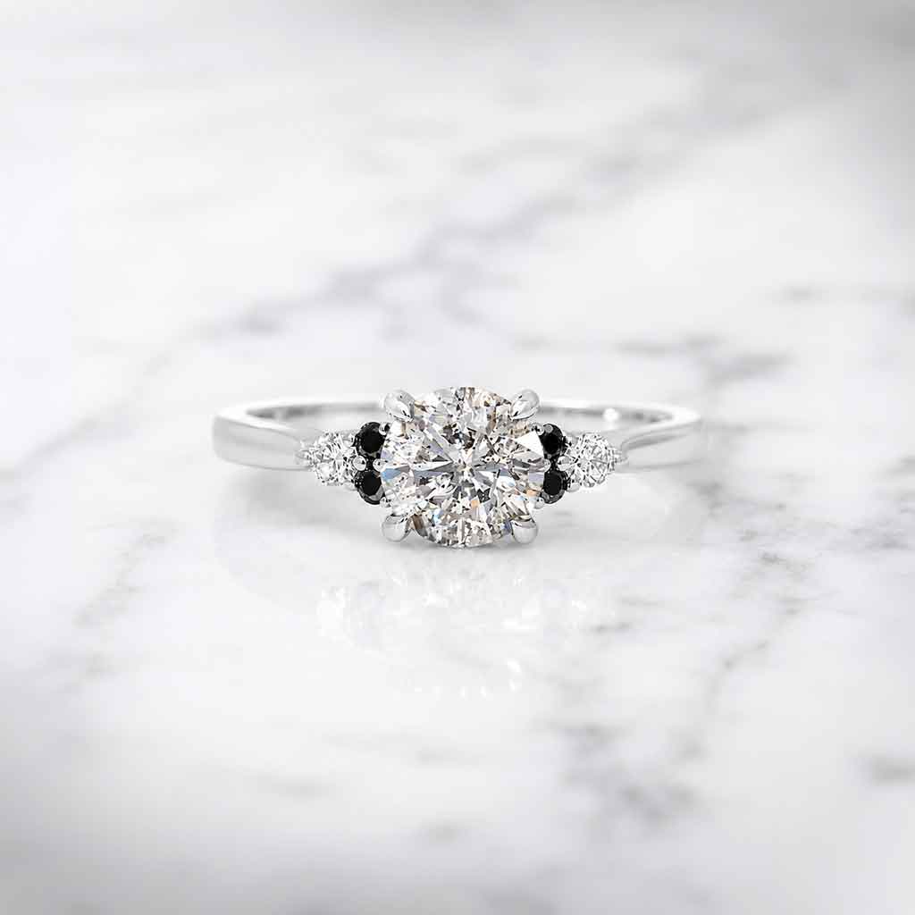 Salt and pepper diamond cluster engagement ring with black diamonds and white diamond accents, crafted in white gold by Sydney jeweller Lizunova