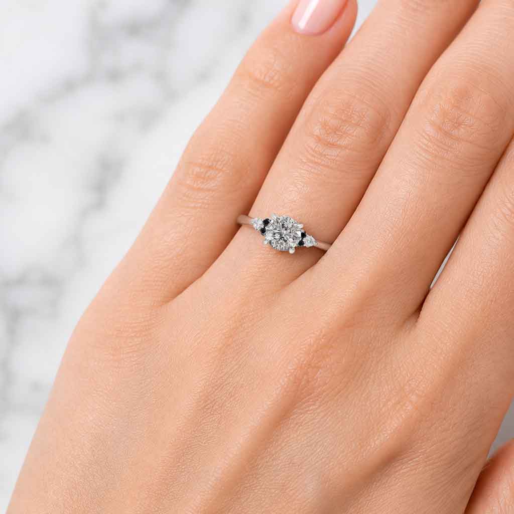 Salt and pepper diamond cluster engagement ring with black diamonds and white diamond accents, crafted in white gold by Sydney jeweller Lizunova