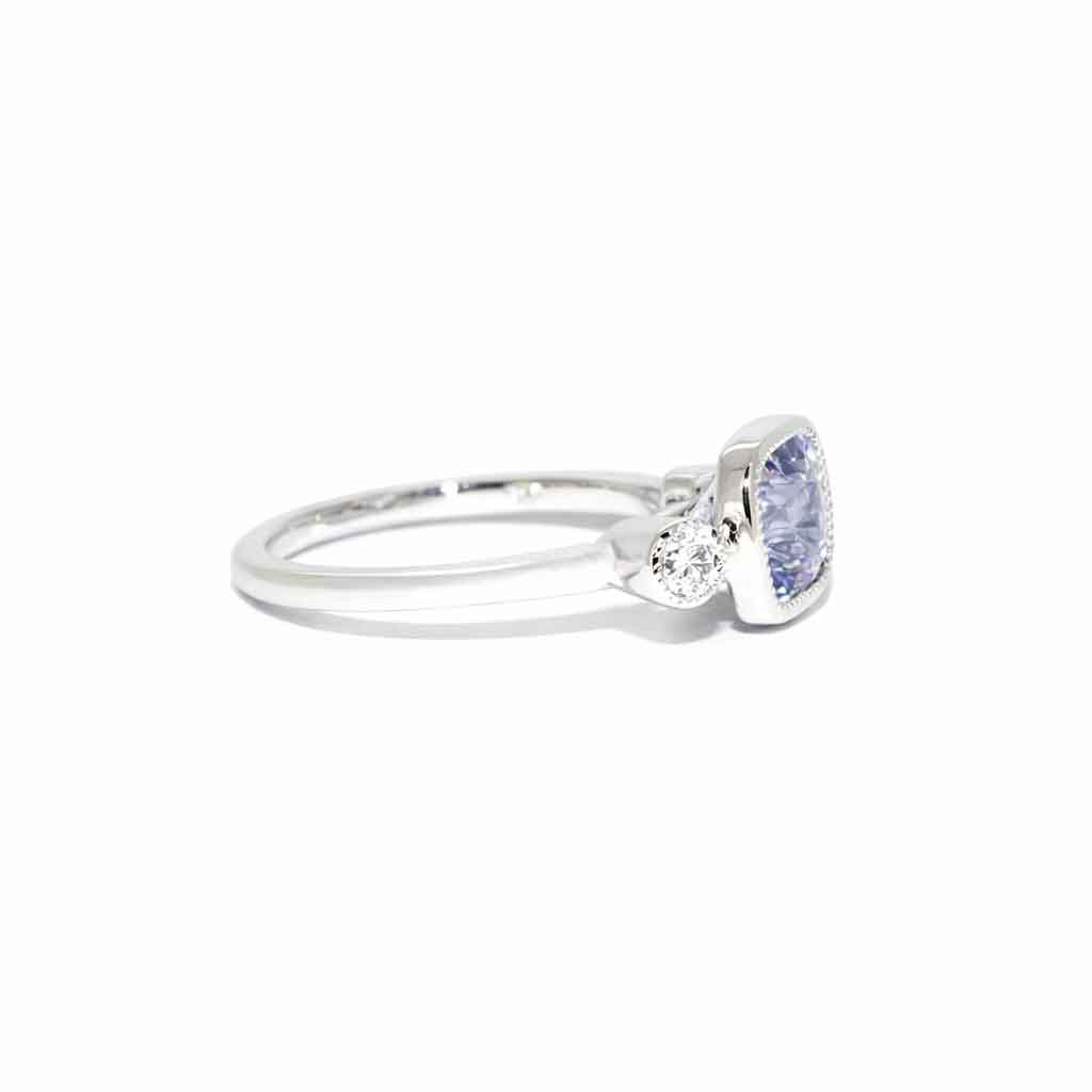 Cushion cut grey spinel diamond trilogy engagement ring in 18k white gold with milgrain detail, handcrafted in Sydney by jeweller Lizunova