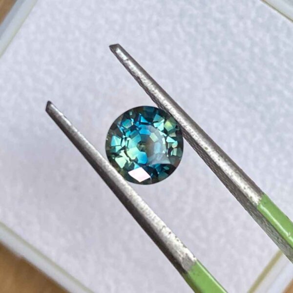 round-Australian-parti-teal-sapphire-custom-engagement-ring-Sydney-jeweller-Lizunova-Fine-Jewels