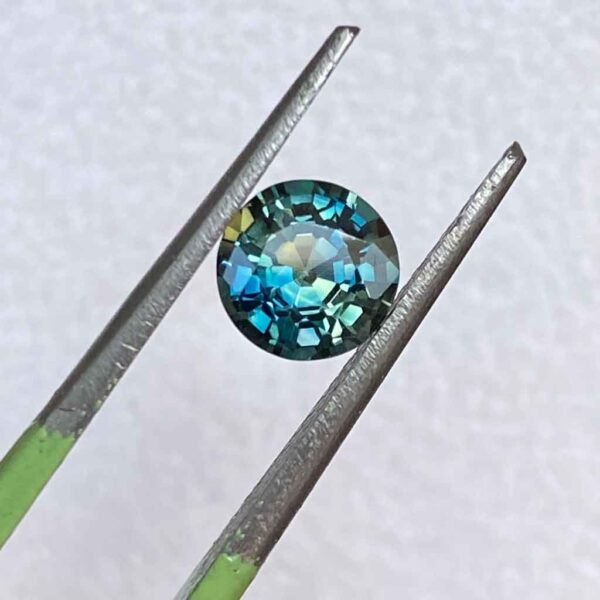 round-Australian-parti-teal-sapphire-custom-engagement-ring-Sydney-jeweller-Lizunova-Fine-Jewels