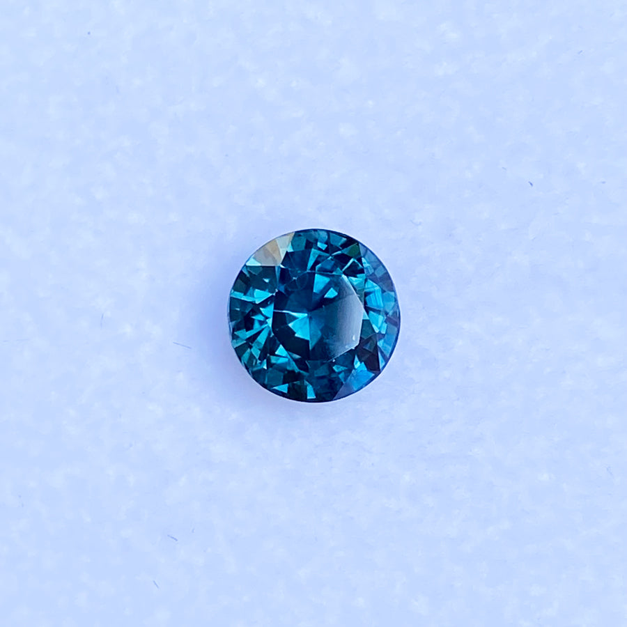 round-teal-sapphire-bespoke-engagement-ring-Sydney-jeweller-Lizunova-Fine-Jewels-Australia