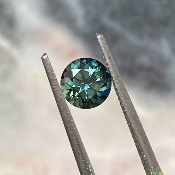 round-australian-teal-sapphire-custom-engagement-ring-Sydney-jeweller-Lizunova-Fine-Jewels