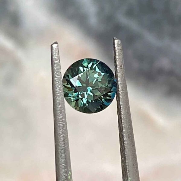 round-australian-teal-sapphire-custom-engagement-ring-Sydney-jeweller-Lizunova-Fine-Jewels